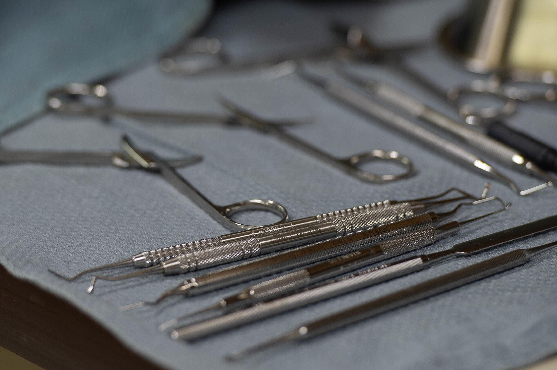 Dental mirrors, probes and scalers laid out on a tray